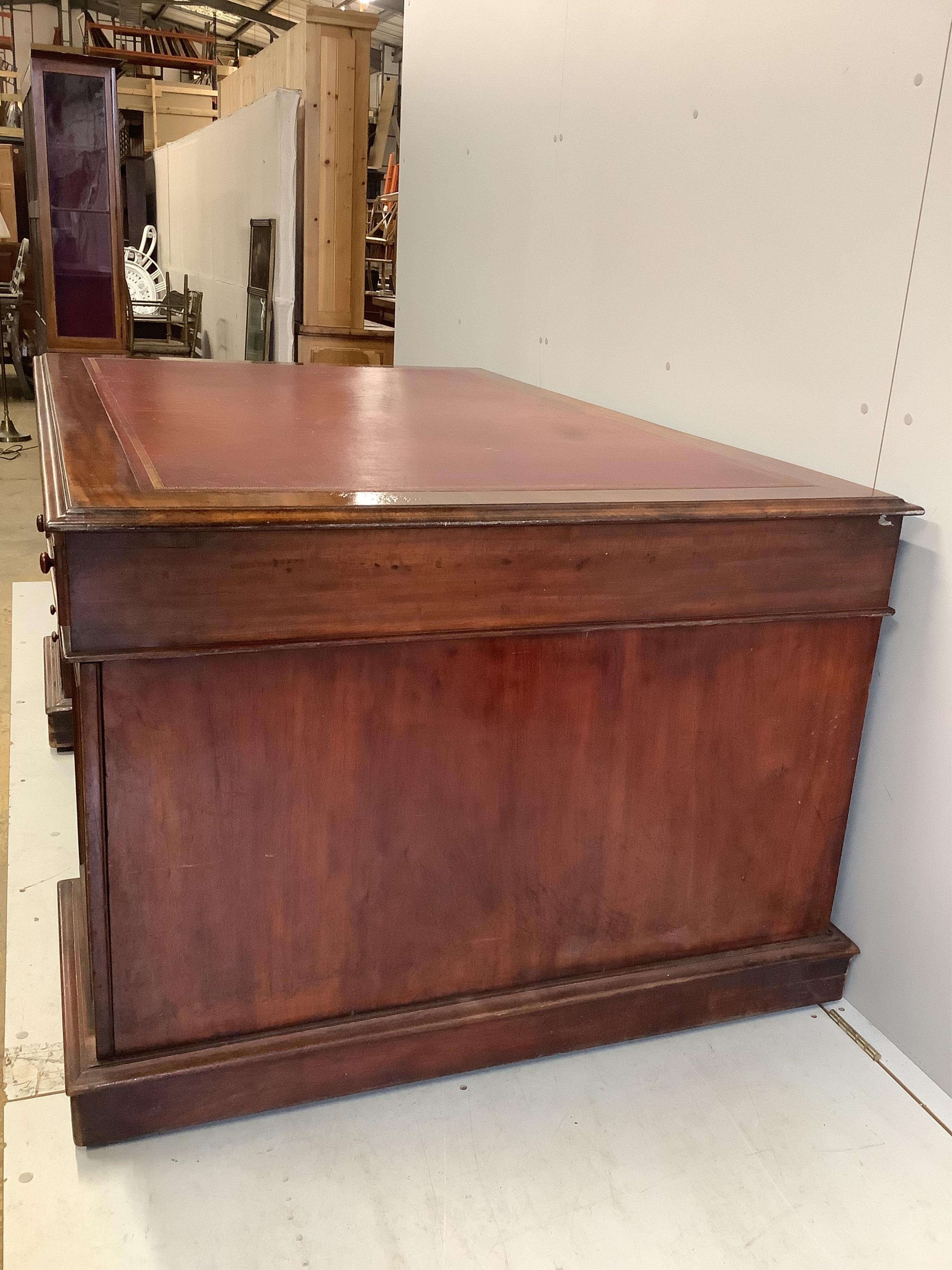 A Victorian mahogany pedestal partner's desk, width 168cm, depth 110cm, height 80cm. Condition - fair